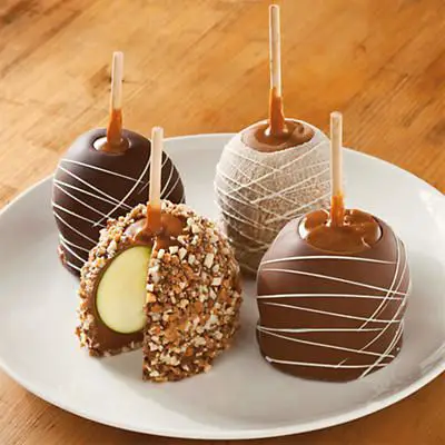 Chocolate Caramel Apples - A gourmet twist on a classic favorite, these crisp Granny Smith apples are hand dipped and decorated in our candy kitchen.: 