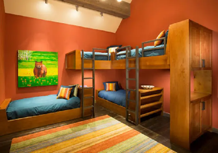 Interior hermoso de un niño durmiendo en colores cálidos que va a crear el ambiente más cómodo.