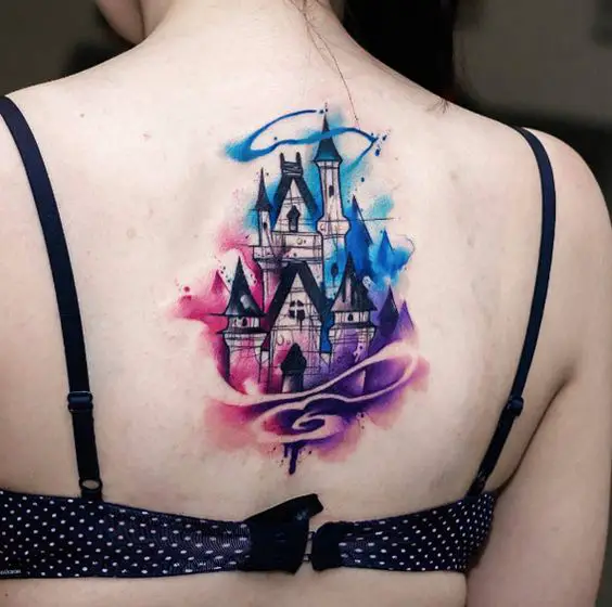 Watercolor Disney castle tattoo on back by Uncl Paul Knows: 