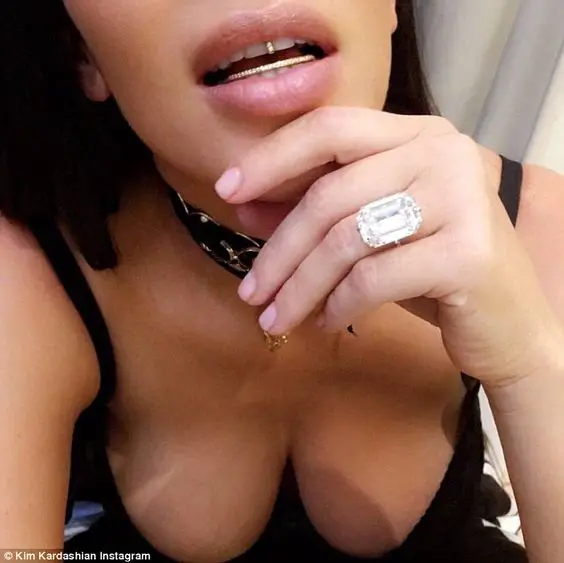 Sorry: Her 20-carat Lorraine Schwartz rock (pictured) was reportedly stolen from her Paris apartment just days after she flaunted it on Instagram in this photo along with her diamond grillz: 