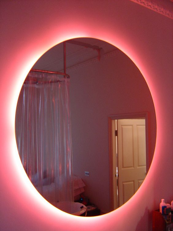 Pink Neon bathroom mirror this is kool would be nice to take a bath and relax: 