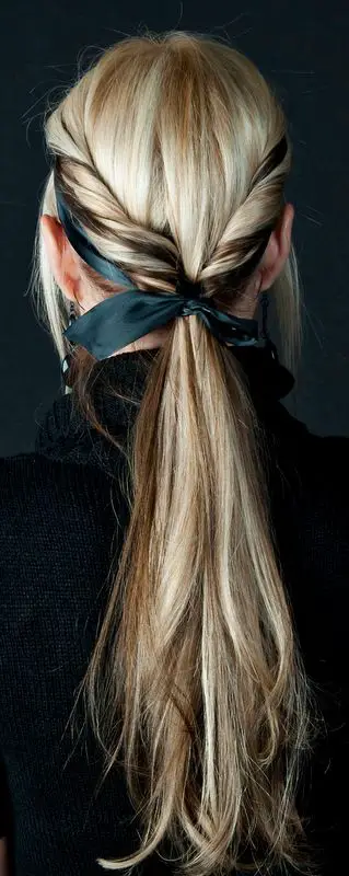 twist hair on both sides, tie both ends into a low ponytail with the lemonhead headband: 