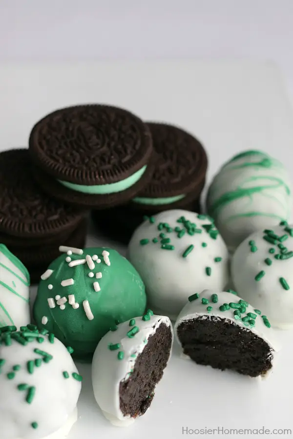 Mint Oreo Truffles - ONLY 3 ingredients is all you need for these delicious St. Patrick's Day treats! The kids will have a blast crushing the Oreos, and helping form the balls. Dip in chocolate coating, add sprinkles and you have a fun treat! Pin to your Recipe Board!