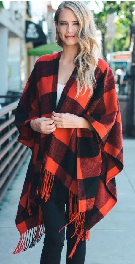 Red and black buffalo plaid poncho is the perfect winter accessory, it's like a blanket that you can wear! Features a tassel bottom and made of soft acrylic. 46" x 54" (Not including tassels) tassels: 