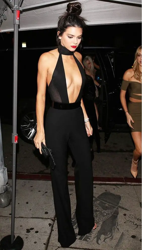 Kendall Jenner wears a sheer black Sergio Hudson jumpsuit.: 