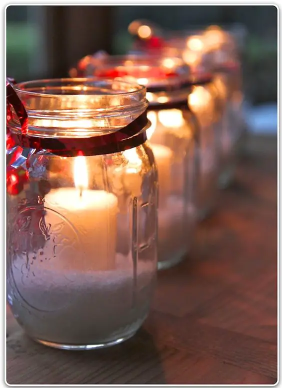 For these candles, use Mason jars, Epsom salts and little candles. Tie some ribbon and an ornament around the top. Candles in glass holders work much, much better - they burned for hours, and the wax doesn't run all over the Epsom salts.: 