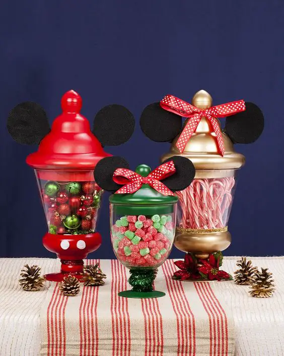 Make Mickey and Minnie the center of your holiday table by adding the iconic ears and a little Christmas décor to simple pedestal jars: 