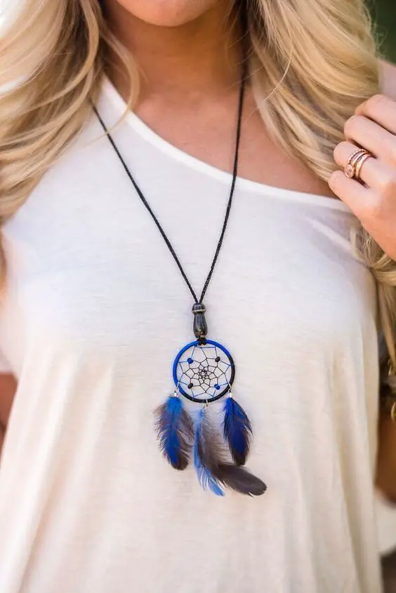 Dream a little dream with these miniature dreamcatcher necklaces. Adorned with a small ceramic bead at the base. - Slip on style, Colors are assorted - Authentically handcrafted - Can also be worn as: 