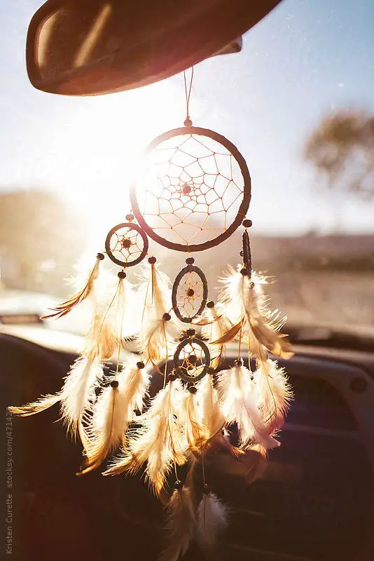 Dream catcher hanging from a car rear view mirror by poorartist | Stocksy United: 