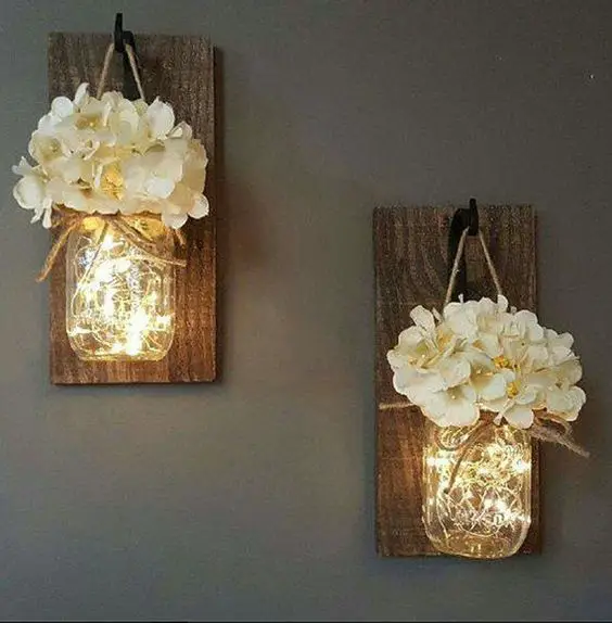 HANGING MASON JAR SCONCES .... with Lights!  LOVE this idea ... so pretty!  Don't you think?  You can find them here (affiliate) ... http://rstyle.me/n/bzem3rb5zc7.: 