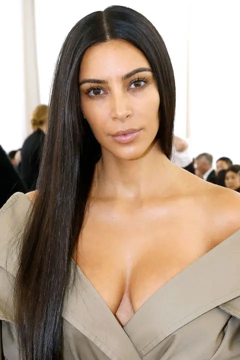 Kim Kardashian's sleek center part is strikingly dramatic all on its own—no volume or makeup required. 