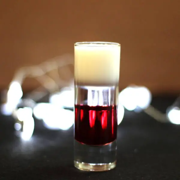 Love Bite Cocktail recipe with cherry liqueur, orange liqueur and cream.