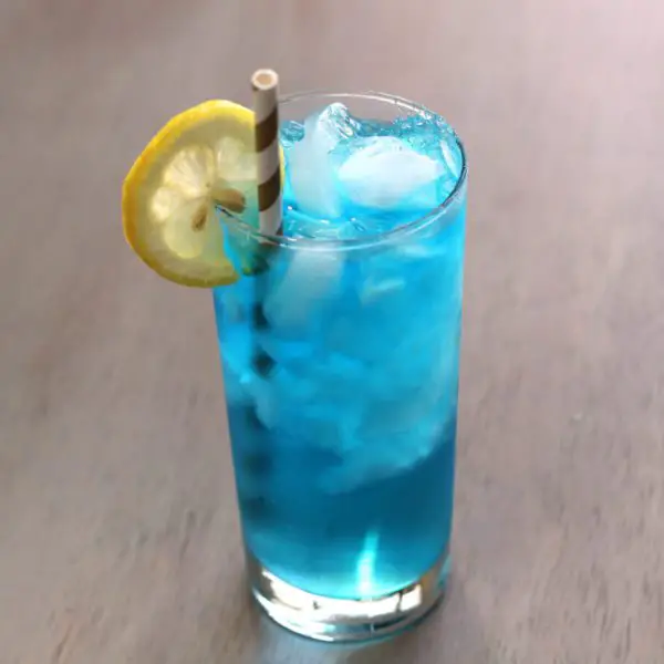 The Sex in the Driveway cocktail recipe is a blue variation on Sex on the Beach.