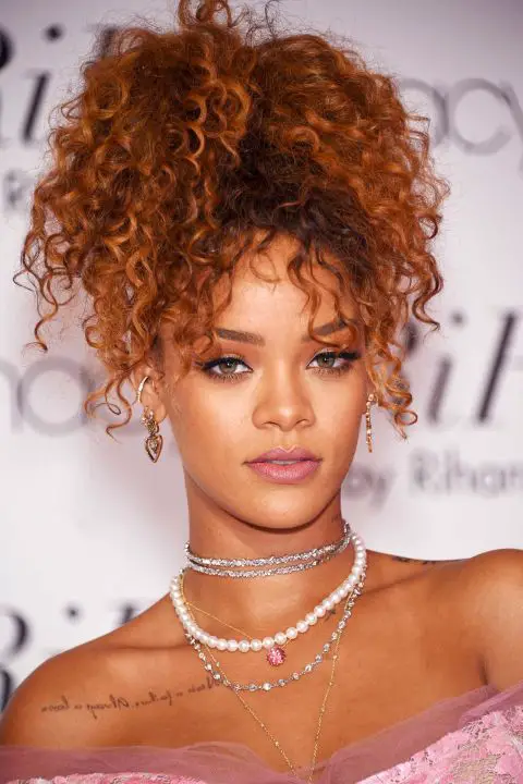 Fluffy auburn curls piled high for the launch of her Riri by Rihanna&nbsp;fragrance. 