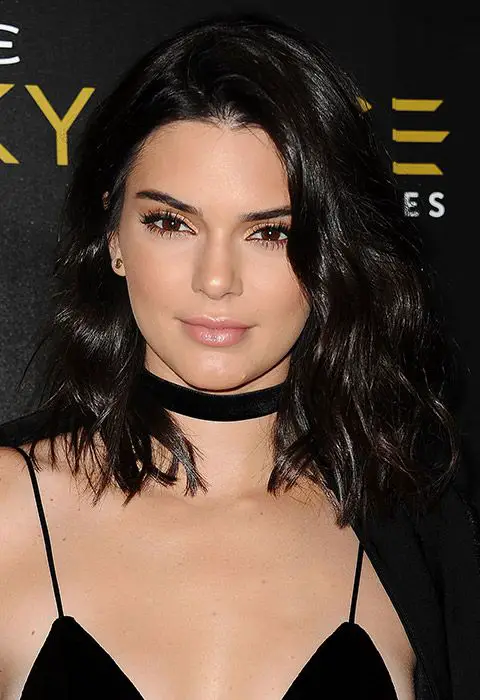 Tousled curls are one of Kendall's fave looks. On this occasion, she ups the fancy for night-time by making them a little tighter and glossier (heaven). Create more structured curls like these using a conical wand and spritz on some high-shine spray to get the same full finish: 