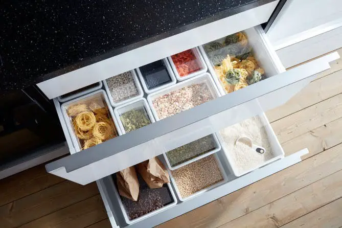 To store different cereals and seasonings, you can use ordinary glass or plastic containers, which will significantly relieve space in the cabinets and help clean the kitchen. 