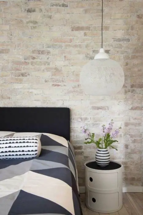 Bedroom wall with stone wallpaper