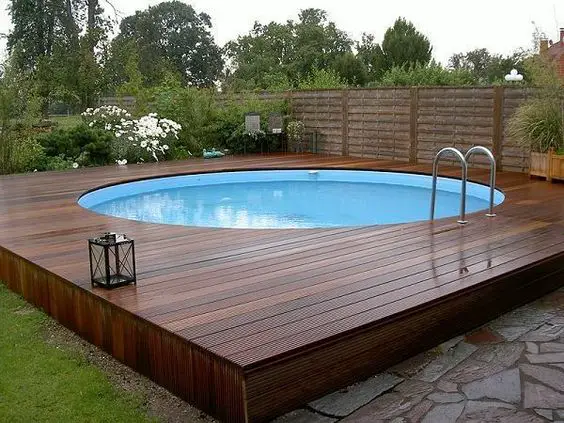 modern above ground pool decks ideas wooden deck round pool lawn stone slabs #modernpoolaboveground